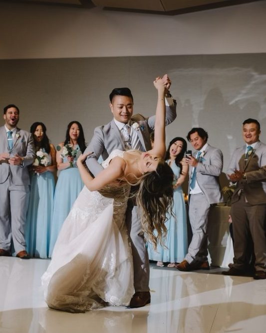 Kelley and John first dance dip with their wedding party